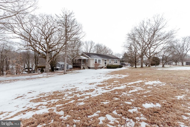 view of yard covered in snow