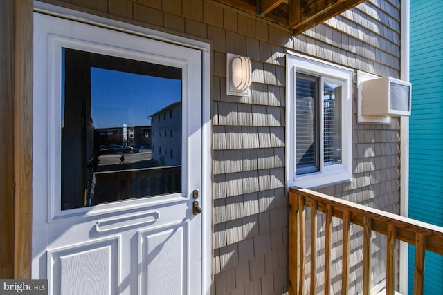 property entrance with a wall mounted AC