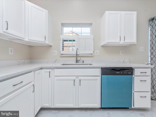 kitchen with a sink, white cabinetry, marble finish floor, stainless steel dishwasher, and light stone countertops