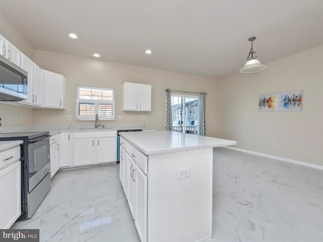 kitchen featuring stainless steel appliances, marble finish floor, white cabinets, and a kitchen island