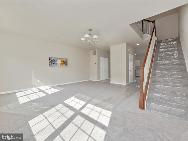 unfurnished living room with stairs, baseboards, a notable chandelier, and light colored carpet