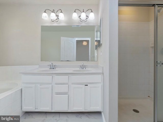 bathroom featuring a garden tub, visible vents, a sink, and a stall shower