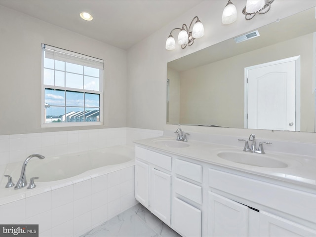 bathroom featuring marble finish floor, visible vents, a sink, and double vanity