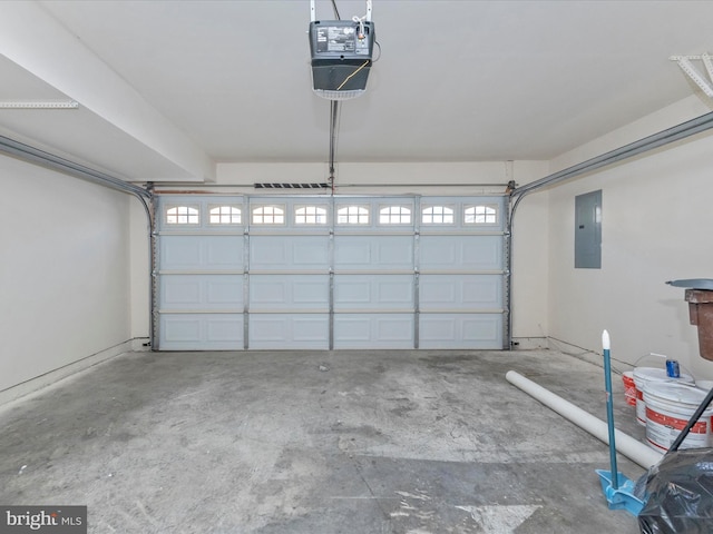 garage with electric panel and a garage door opener