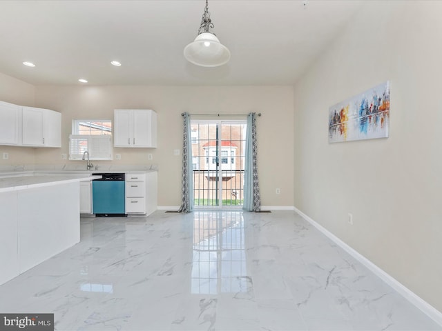 kitchen featuring dishwasher, hanging light fixtures, marble finish floor, light countertops, and white cabinetry