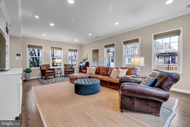 living room featuring plenty of natural light, ornamental molding, and dark wood-style flooring