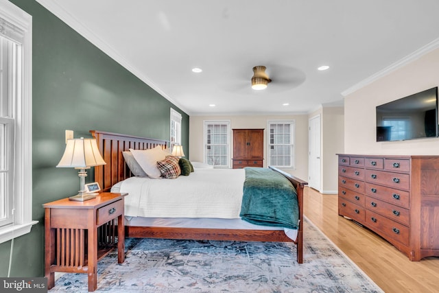 bedroom with baseboards, recessed lighting, wood finished floors, and crown molding