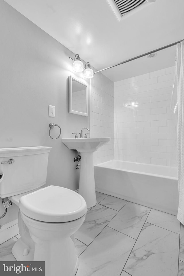 full bath with shower / bath combination with curtain, marble finish floor, visible vents, and toilet