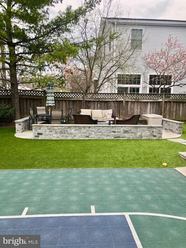 exterior space with a patio area, fence, and an outdoor living space