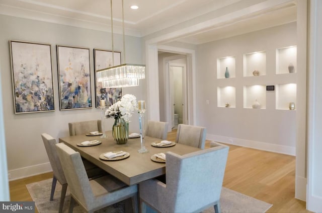 dining room with recessed lighting, baseboards, and wood finished floors