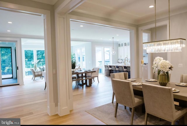 dining room featuring light wood-style flooring and recessed lighting