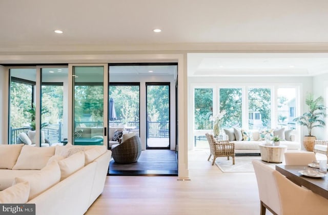 doorway to outside with light wood-style floors and recessed lighting