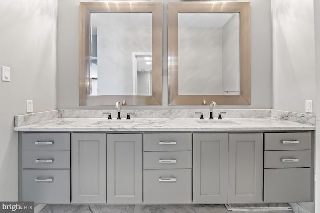 bathroom with double vanity and a sink