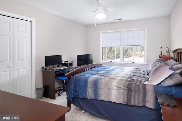 bedroom with ceiling fan, carpet floors, and visible vents