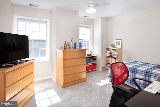 bedroom featuring visible vents, baseboards, and light colored carpet