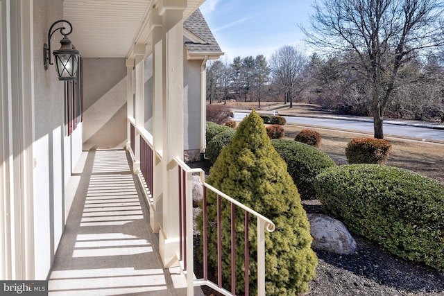 view of property exterior featuring a shingled roof