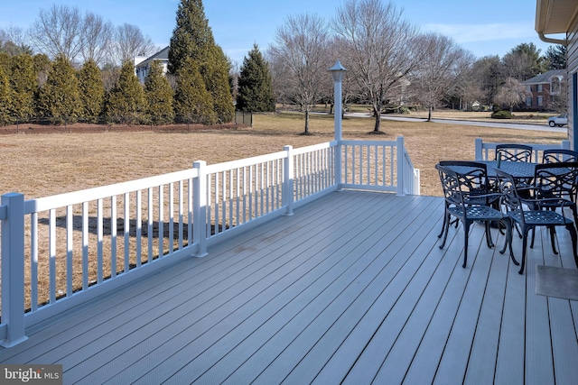 deck with outdoor dining area