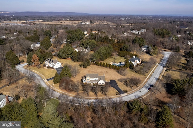 drone / aerial view featuring a view of trees