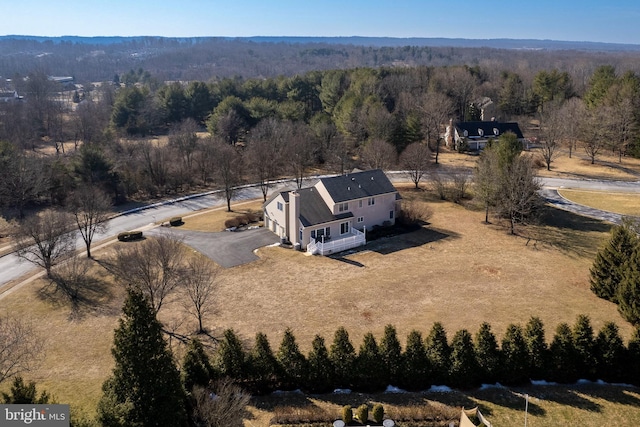 drone / aerial view with a view of trees