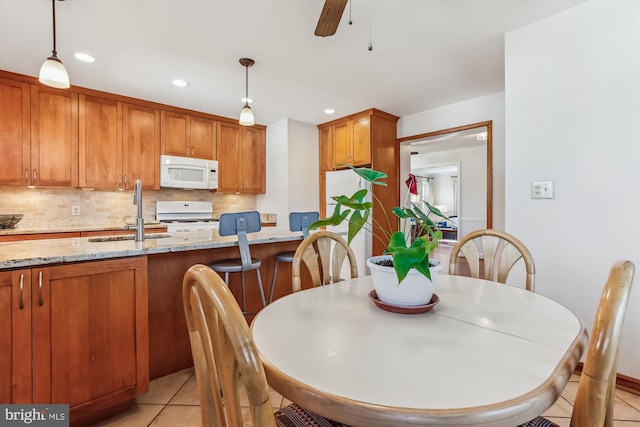 dining space featuring light tile patterned floors, ceiling fan, and recessed lighting