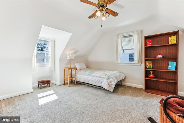 carpeted bedroom with baseboards, lofted ceiling, and ceiling fan