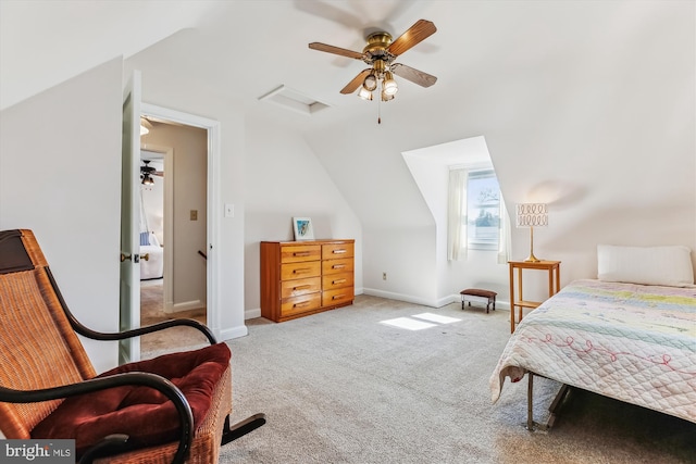 carpeted bedroom with ceiling fan, attic access, lofted ceiling, and baseboards