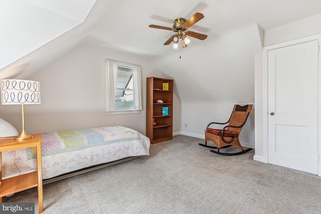 bedroom featuring baseboards, lofted ceiling, carpet, and a ceiling fan