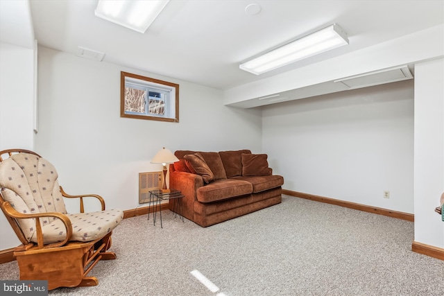 living area with carpet and baseboards