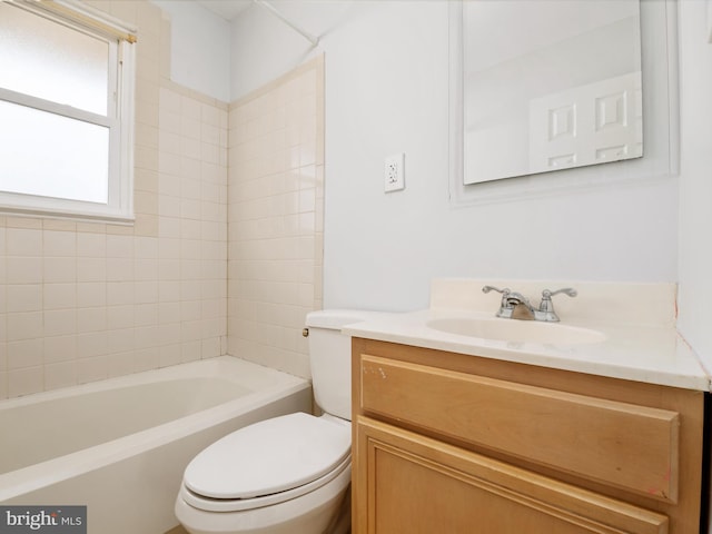 bathroom with toilet, tub / shower combination, and vanity