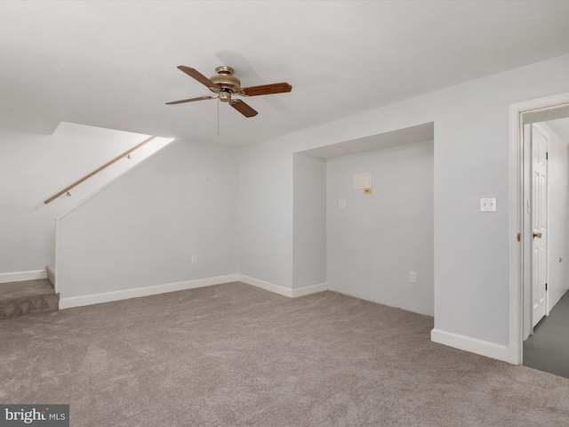 bonus room with ceiling fan, carpet floors, and stairs