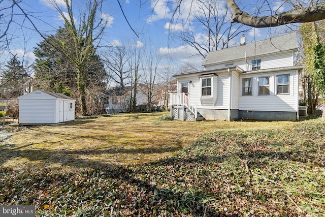 view of yard with a storage shed, central AC, and an outdoor structure