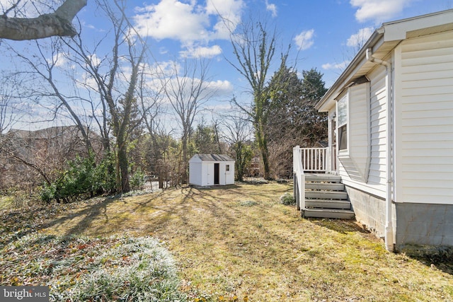 view of yard with an outbuilding and a shed