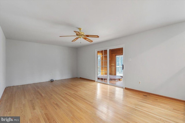 unfurnished room with light wood-style flooring, baseboards, and ceiling fan