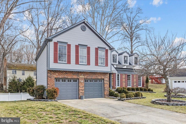 view of front of home featuring a front yard, brick siding, fence, and driveway