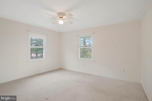 unfurnished room featuring light carpet, visible vents, and baseboards