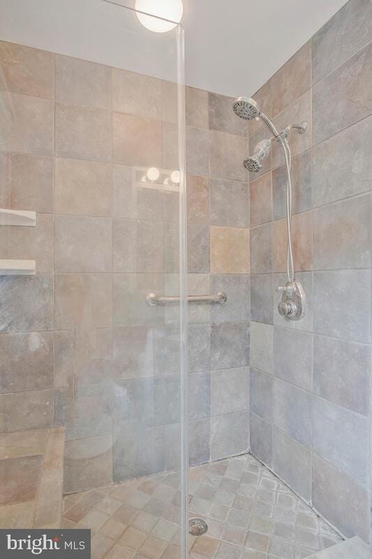 full bath with a shower stall