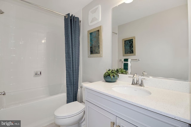 bathroom featuring shower / tub combo, vanity, and toilet