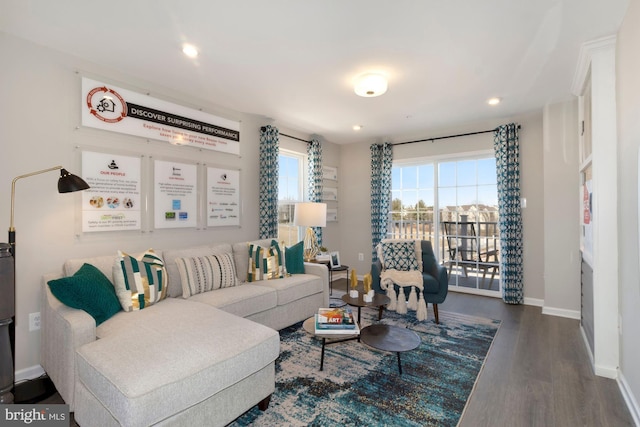 living area with recessed lighting, wood finished floors, and baseboards