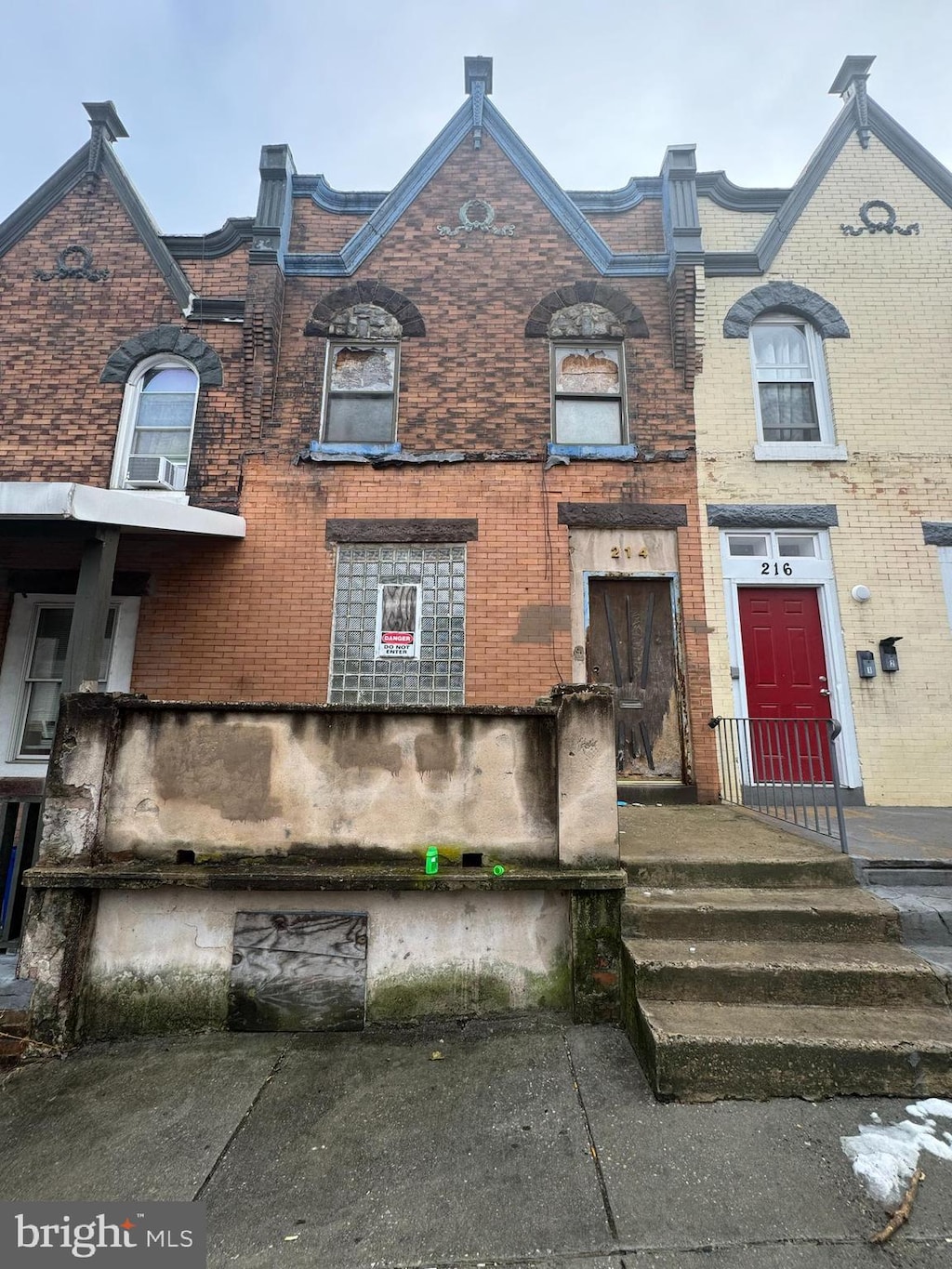 view of property with brick siding