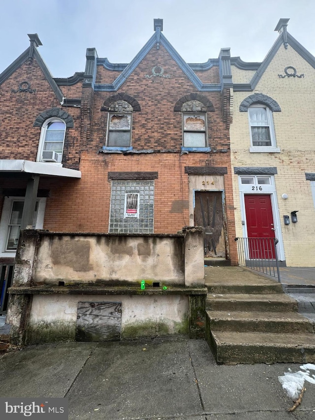 view of property with brick siding