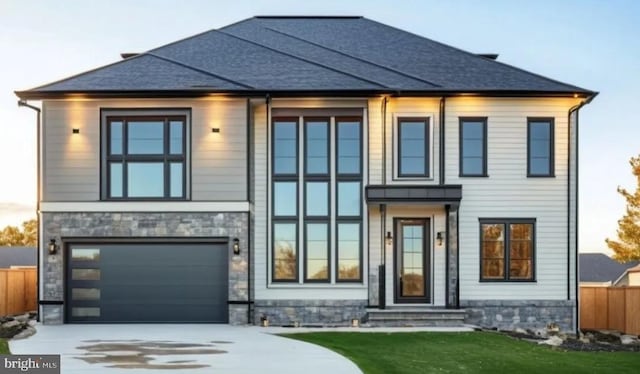 view of front of home with a garage, entry steps, concrete driveway, and fence