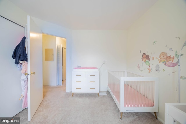 unfurnished bedroom featuring light carpet