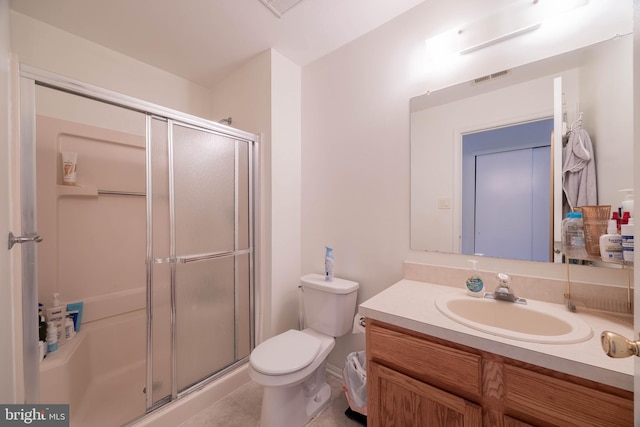 bathroom featuring toilet, a shower stall, visible vents, and vanity