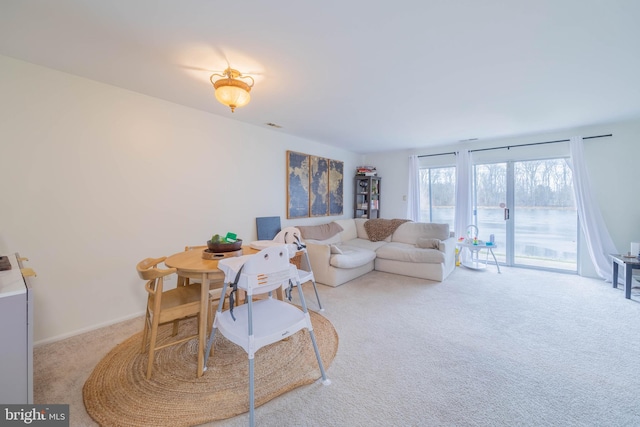 interior space with baseboards and carpet flooring