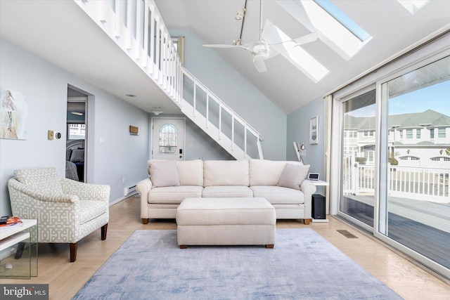 14 Buckingham Ave, Harvey Cedars, NJ 08008 - living area featuring a skylight, visible vents, a ceiling fan, stairs, and high vaulted ceiling
