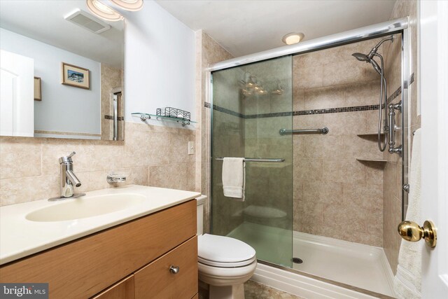 14 Buckingham Ave, Harvey Cedars, NJ 08008 - bathroom with toilet, a stall shower, visible vents, and tile walls