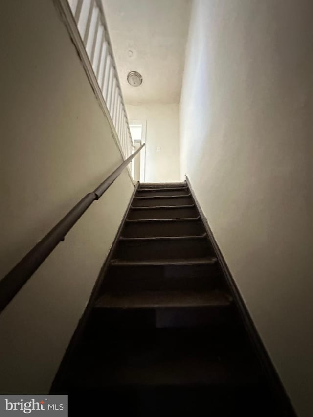 stairs featuring baseboards