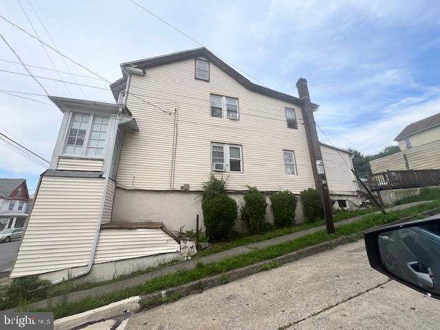 view of home's exterior featuring a chimney