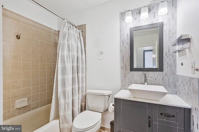 bathroom featuring vanity, toilet, and shower / bathtub combination with curtain