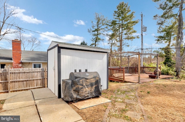 view of shed with fence